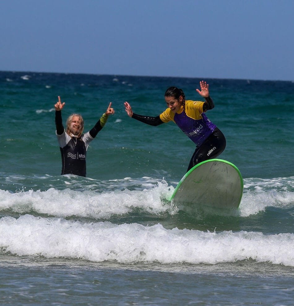 Julian giving someone a private lesson on Perranporth Beach