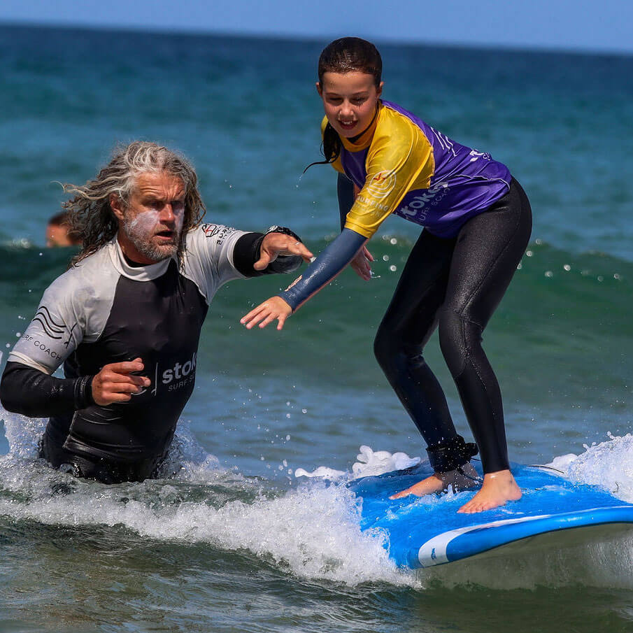 Julian of Stoked Surf School giving a surf lesson