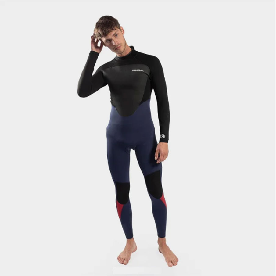 An adult in a Gul wetsuit (for surf hire)