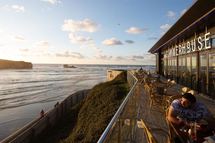 A view of Summerhouse at sunset on Perranporth Beach