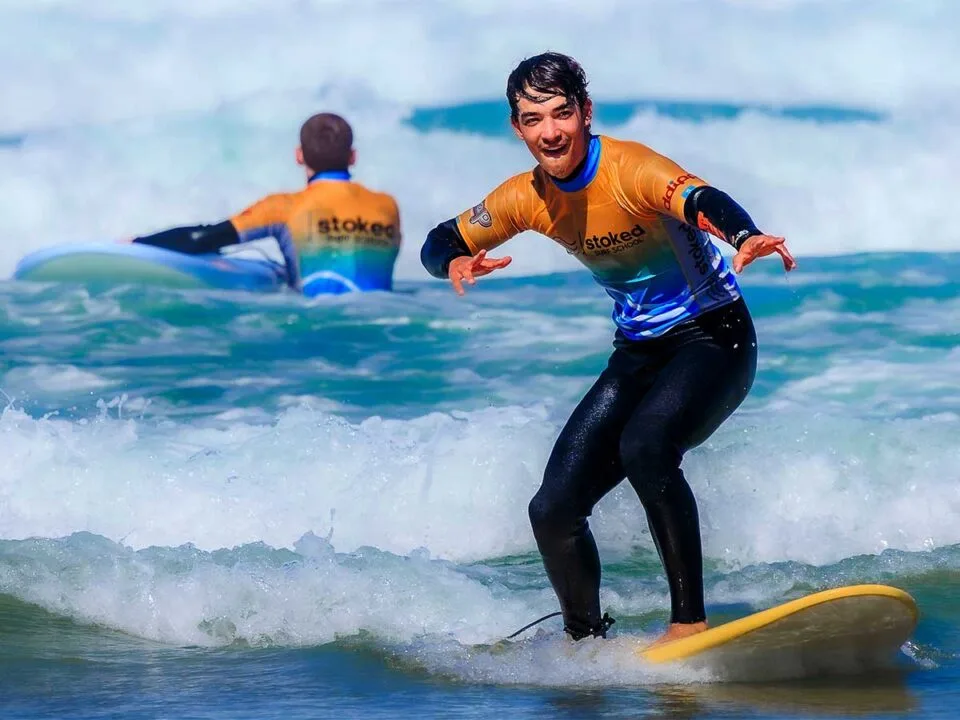 A surfer taking advantage of our black friday surf deal