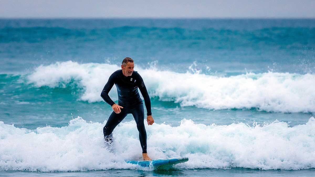 A surfer enjoying Perranporth's winter surf