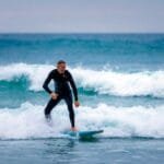 A surfer enjoying Perranporth's winter surf