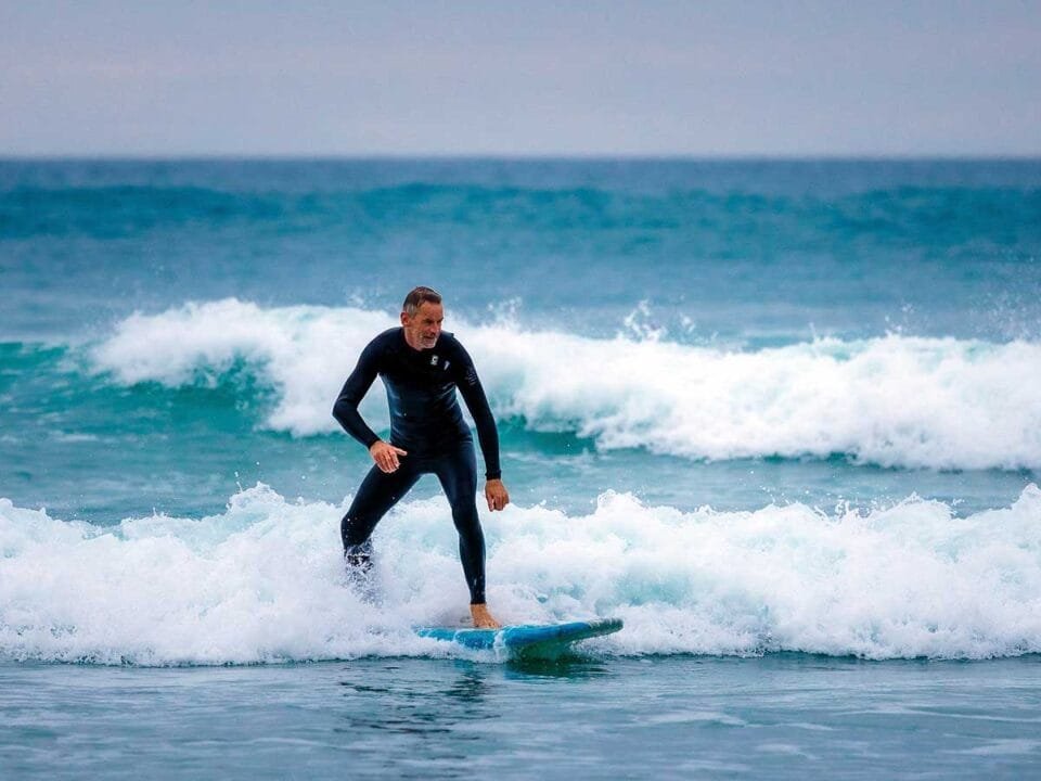 A surfer enjoying Perranporth's winter surf