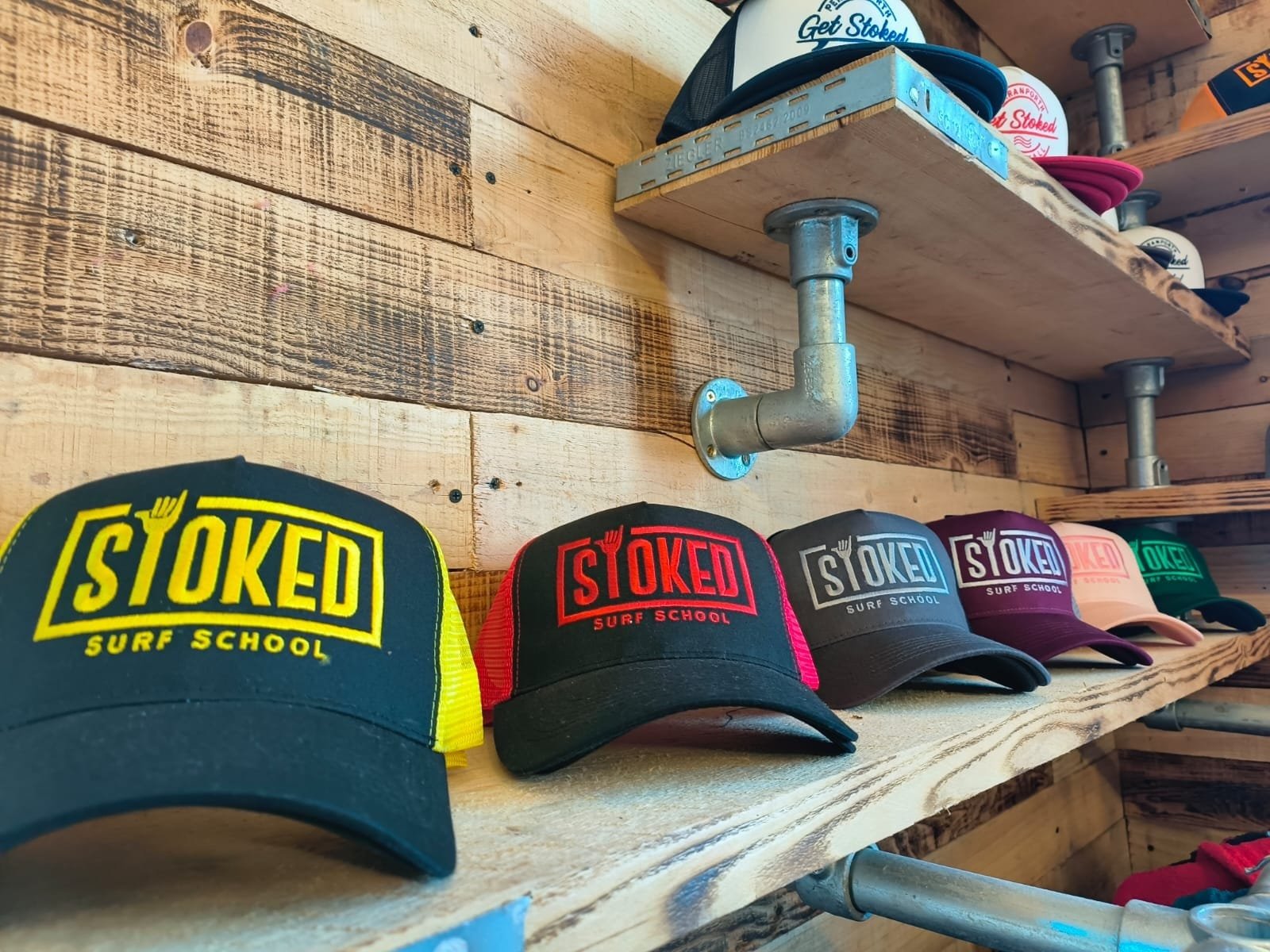 New merch! Caps with Stoked Surf School's logo on them.