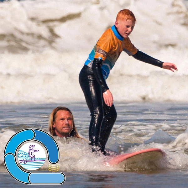 Coach Will watching a surf student standing on their board in a broken whitewater wave - The blue loop in our surf ability measure