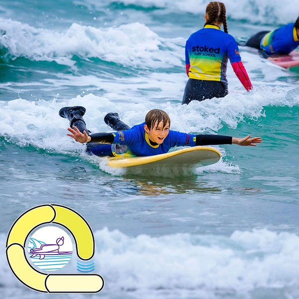 A surf student demonstrating the prone stance - The yellow loop in our surf ability measure