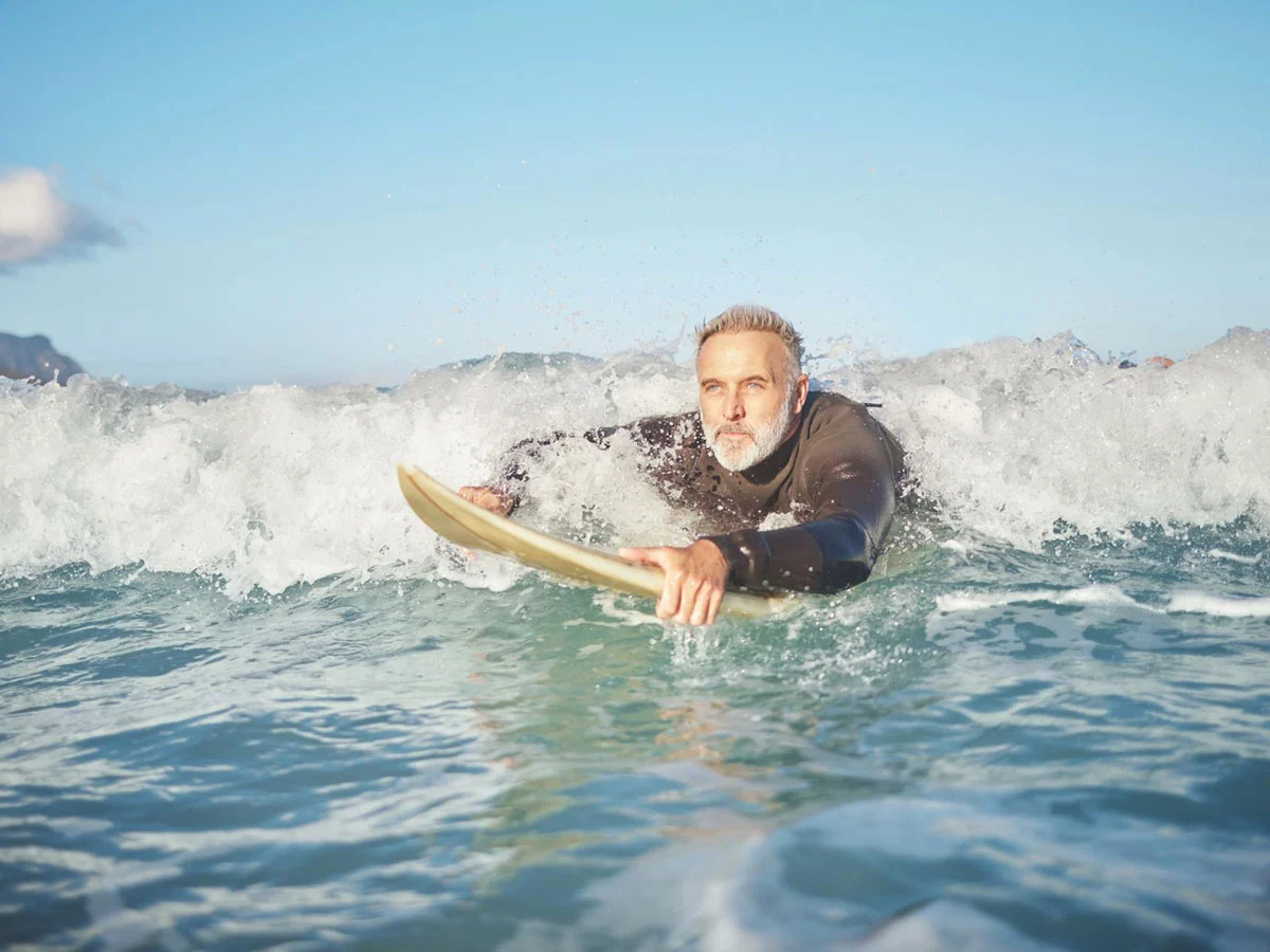 A man surfing at Easter with Stoked Surf School