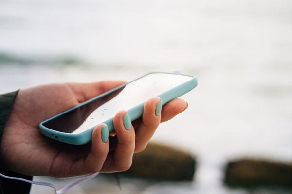 Someone holding a mobile phone