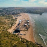 Tunes in the Dunes 2026 Offers at Stoked Surf School 2 An aerial view of the Tunes in the Dunes festival in Perranporth