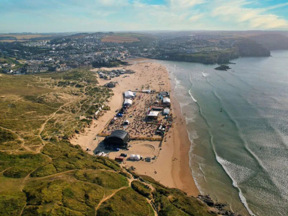 Tunes in the Dunes 2026 Offers at Stoked Surf School 1 An aerial view of the Tunes in the Dunes festival in Perranporth
