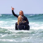 Stoked Milestone Achieved: 1,000 Reviews! 2 Stoked coaches Julian and Will celebrating 1000 reviews